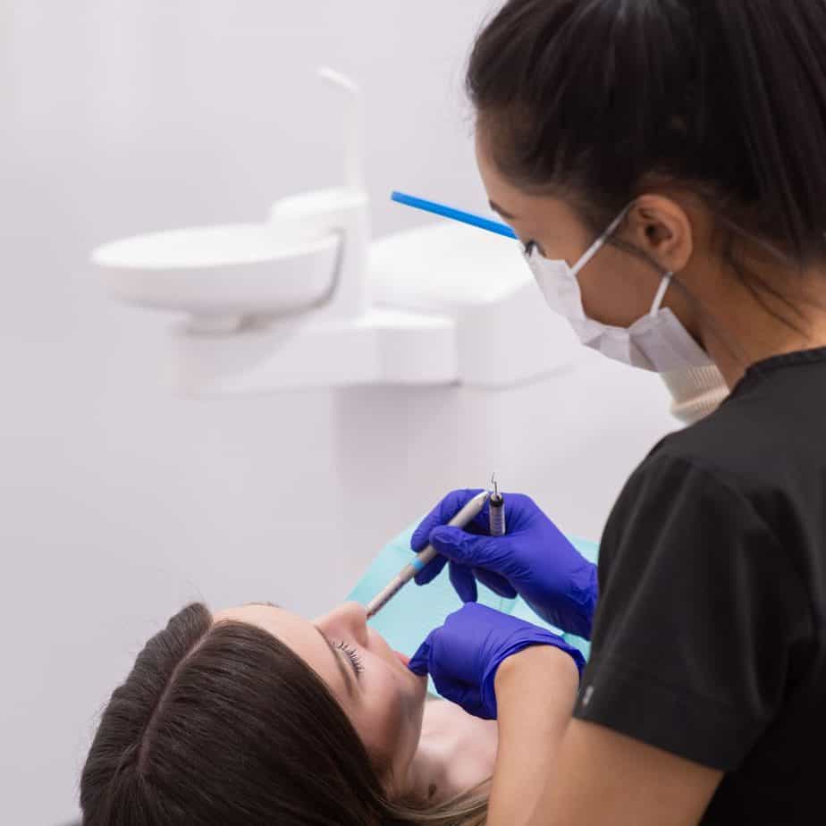 Dental hygienist working with a patient at Sierra Dental clinic in Calgary SW