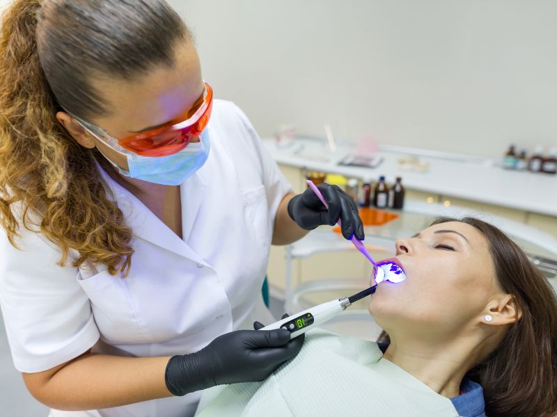 Dentist performing a procedure on a patient under IV sedation.